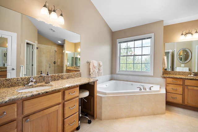 1433 Bicentennial Pkwy, Ann Arbor, MI 48108 - bathroom featuring a stall shower, a bath, tile patterned floors, vaulted ceiling, and two vanities