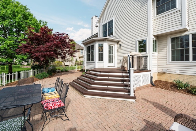 1433 Bicentennial Pkwy, Ann Arbor, MI 48108 - view of patio featuring fence, outdoor dining area, and a deck