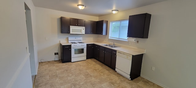 21276 Abrahm St, Clinton Township, MI 48035 - kitchen with white appliances, a sink, light countertops, and stone finish flooring