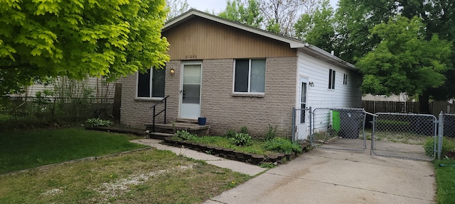 21276 Abrahm St, Clinton Township, MI 48035 - view of front of home featuring a gate and brick siding