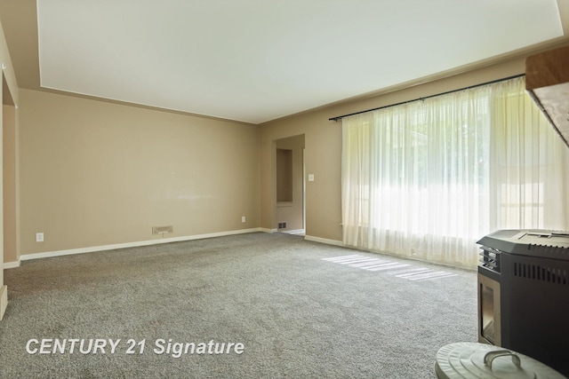 1415 Coolidge Ave, Saginaw, MI 48638 - unfurnished living room with carpet flooring and baseboards