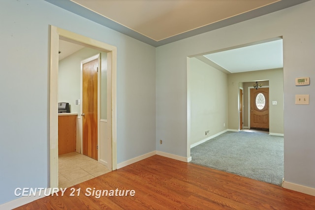 1415 Coolidge Ave, Saginaw, MI 48638 - spare room featuring light wood-style floors and baseboards