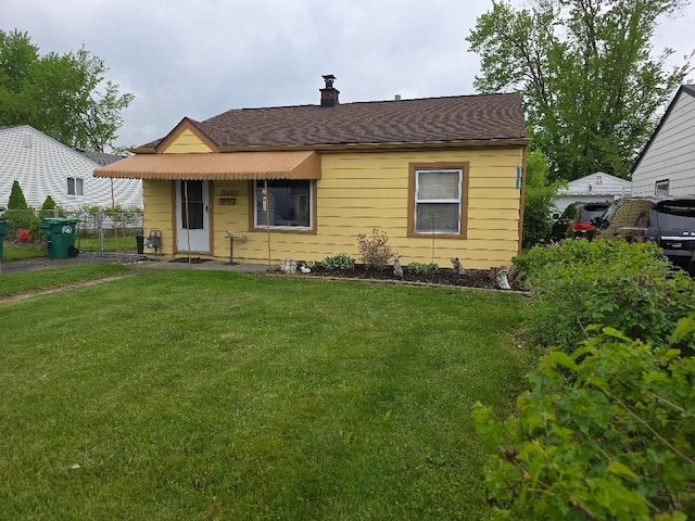 28465 John Hauk St, Garden City, MI 48135 - bungalow-style house featuring a chimney and roof with shingles
