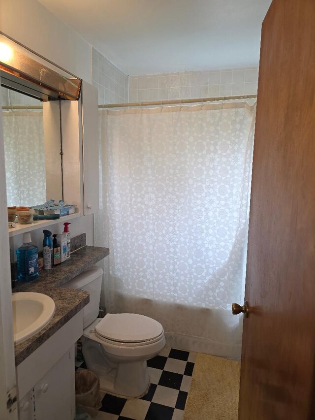 28465 John Hauk St, Garden City, MI 48135 - bathroom featuring tile patterned floors, toilet, vanity, shower / tub combo, and wallpapered walls