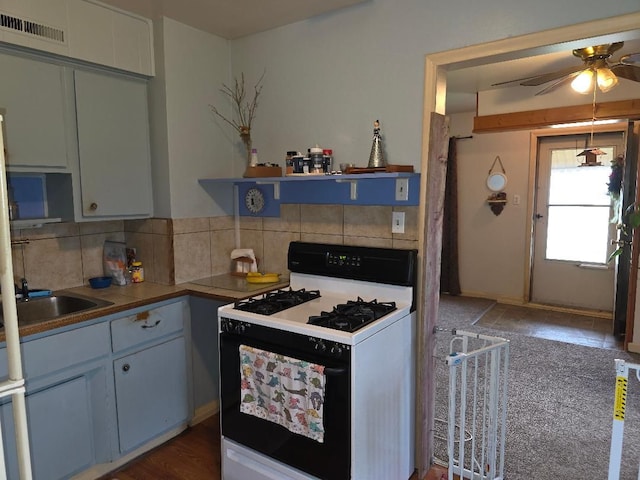 28465 John Hauk St, Garden City, MI 48135 - kitchen with range with gas cooktop, ceiling fan, backsplash, and a sink