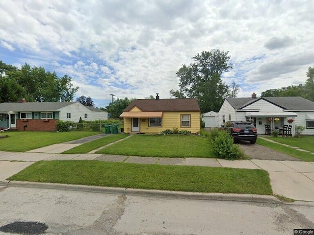 28465 John Hauk St, Garden City, MI 48135 - view of front of house featuring driveway and a front lawn