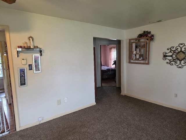 28465 John Hauk St, Garden City, MI 48135 - spare room featuring dark carpet, plenty of natural light, and baseboards