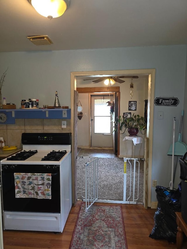 28465 John Hauk St, Garden City, MI 48135 - kitchen with gas range oven, wood finished floors, and a ceiling fan