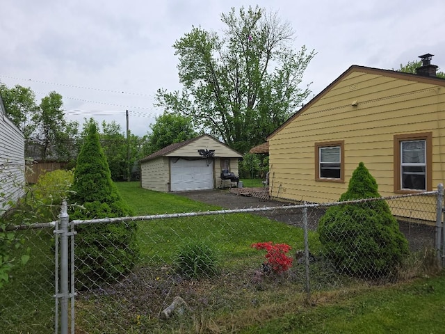 28465 John Hauk St, Garden City, MI 48135 - view of side of property featuring a garage, an outdoor structure, and asphalt driveway