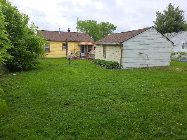 28465 John Hauk St, Garden City, MI 48135 - back of house featuring a yard