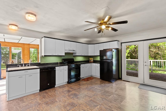 601 N Occidental Rd, Tecumseh, MI 49286 - kitchen with black appliances, under cabinet range hood, dark countertops, a ceiling fan, and a sink