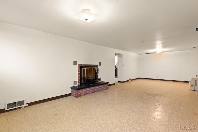 601 N Occidental Rd, Tecumseh, MI 49286 - below grade area with tile patterned floors, a fireplace, and baseboards