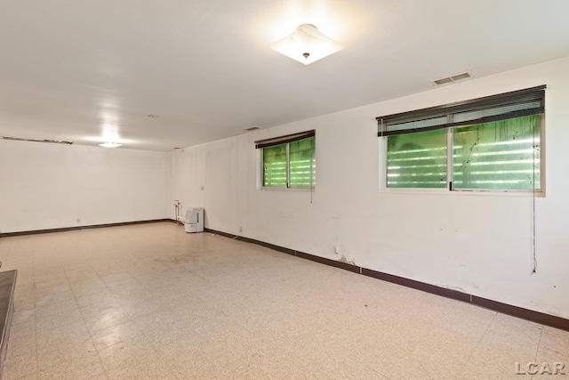 601 N Occidental Rd, Tecumseh, MI 49286 - spare room with tile patterned floors and baseboards