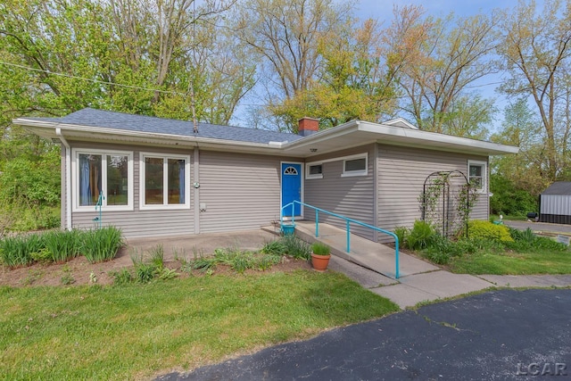 601 N Occidental Rd, Tecumseh, MI 49286 - view of front of house featuring a chimney