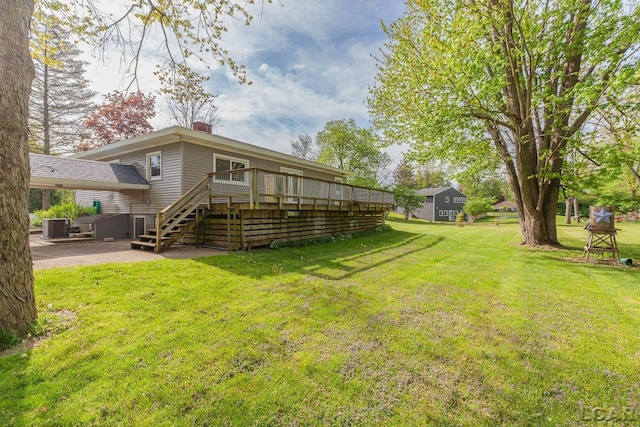601 N Occidental Rd, Tecumseh, MI 49286 - back of property featuring a deck, cooling unit, a lawn, a chimney, and a patio