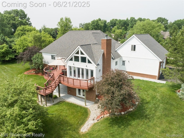 2449 Woodvale Trl, Brighton, MI 48114 - back of house featuring a wooden deck, french doors, a lawn, a chimney, and roof with shingles