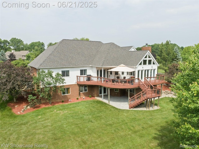 2449 Woodvale Trl, Brighton, MI 48114 - back of property with a deck, a patio, a chimney, a yard, and a shingled roof