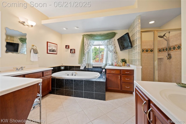 2449 Woodvale Trl, Brighton, MI 48114 - full bathroom with two vanities, a garden tub, a shower stall, tile patterned flooring, and recessed lighting