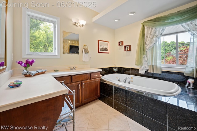 2449 Woodvale Trl, Brighton, MI 48114 - bathroom featuring plenty of natural light, vanity, a bath, and tile patterned flooring
