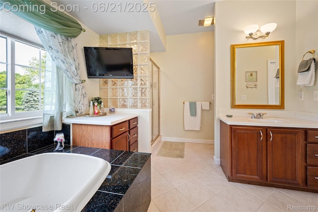 2449 Woodvale Trl, Brighton, MI 48114 - bathroom with vanity, a bathtub, tile patterned flooring, and a shower stall