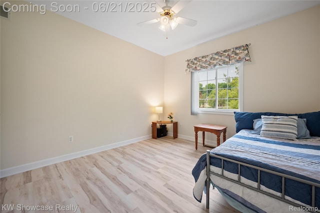 2449 Woodvale Trl, Brighton, MI 48114 - bedroom with wood finished floors and a ceiling fan