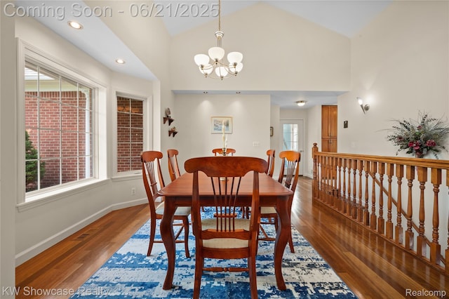 2449 Woodvale Trl, Brighton, MI 48114 - dining area featuring wood finished floors, a chandelier, recessed lighting, and high vaulted ceiling