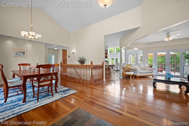 2449 Woodvale Trl, Brighton, MI 48114 - dining area featuring a chandelier, high vaulted ceiling, wood finished floors, and ceiling fan