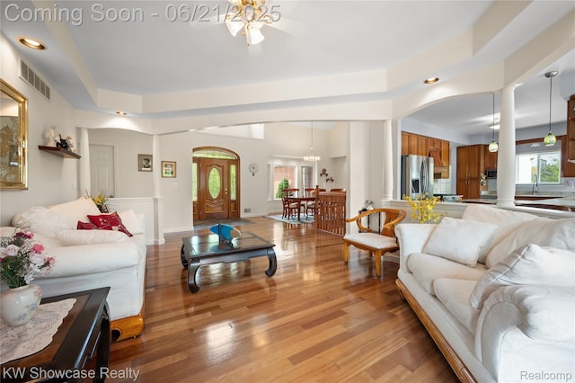 2449 Woodvale Trl, Brighton, MI 48114 - living room featuring a ceiling fan, light wood finished floors, recessed lighting, and arched walkways