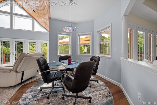 2449 Woodvale Trl, Brighton, MI 48114 - dining space with french doors, plenty of natural light, a chandelier, and dark wood-style flooring