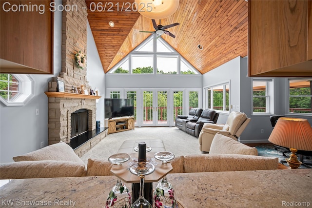 2449 Woodvale Trl, Brighton, MI 48114 - carpeted living area with wooden ceiling, high vaulted ceiling, a fireplace, and a ceiling fan