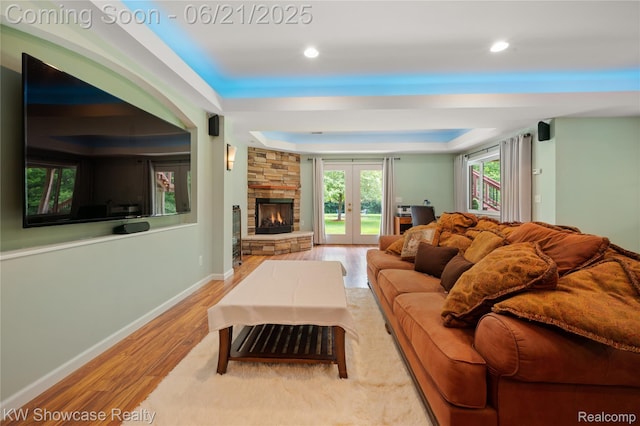 2449 Woodvale Trl, Brighton, MI 48114 - living area featuring wood finished floors, a raised ceiling, recessed lighting, and french doors