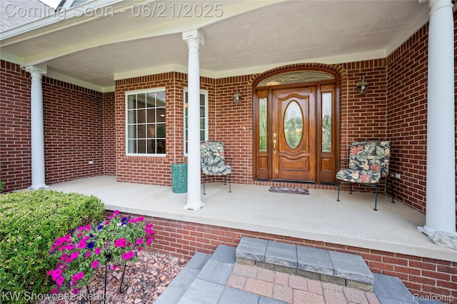 2449 Woodvale Trl, Brighton, MI 48114 - entrance to property with covered porch and brick siding