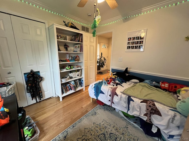 9299 Parkland Dr, Ypsilanti, MI 48197 - bedroom featuring wood finished floors, a closet, and a ceiling fan