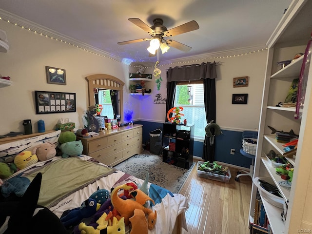9299 Parkland Dr, Ypsilanti, MI 48197 - bedroom with crown molding, hardwood / wood-style flooring, a ceiling fan, and baseboards