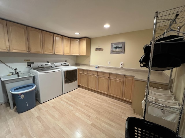 9299 Parkland Dr, Ypsilanti, MI 48197 - washroom with cabinet space, washer and dryer, light wood finished floors, and recessed lighting