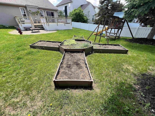9299 Parkland Dr, Ypsilanti, MI 48197 - view of yard featuring a garden, a deck, and a playground