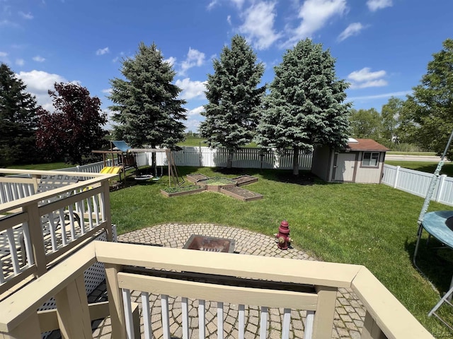 9299 Parkland Dr, Ypsilanti, MI 48197 - view of yard with a shed, a garden, an outdoor structure, and a playground