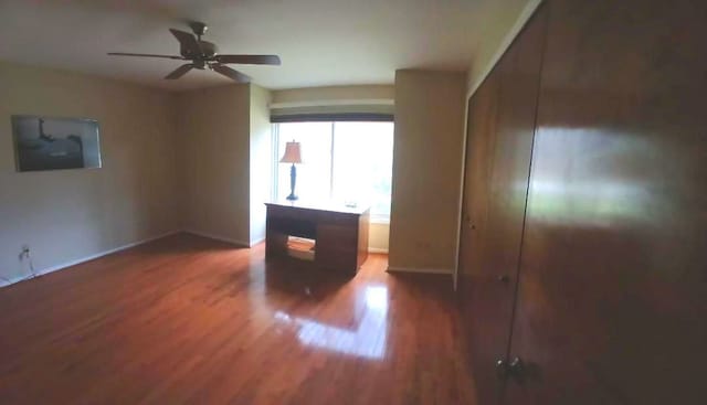 3531 E Commerce Rd, Commerce Twp, MI 48382 - unfurnished bedroom featuring wood finished floors and ceiling fan