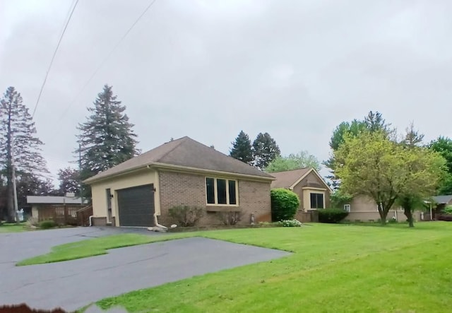 3531 E Commerce Rd, Commerce Twp, MI 48382 - ranch-style house with a garage, a front lawn, driveway, and brick siding