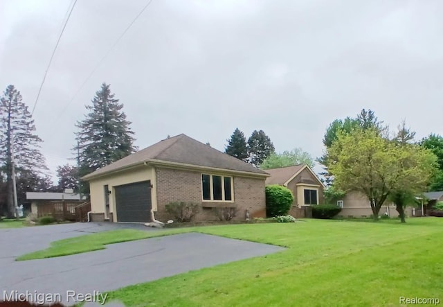 3531 E Commerce Rd, Commerce Twp, MI 48382 - ranch-style house featuring brick siding, a front yard, a garage, and driveway