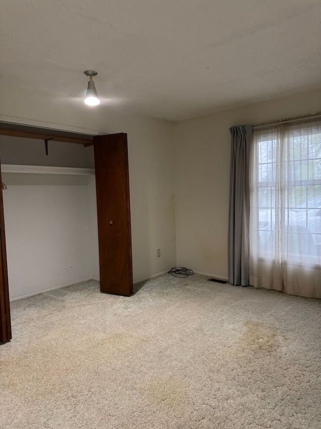 8610 N Waumegah Rd, Clarkston, MI 48348 - unfurnished bedroom featuring carpet and baseboards