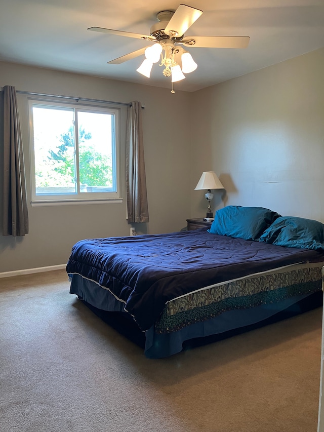 11300 Hegel Rd, Goodrich, MI 48438 - carpeted bedroom with a ceiling fan and baseboards