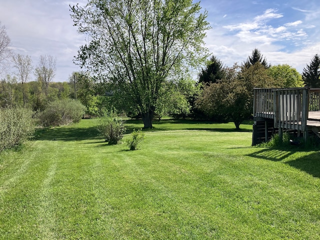 11300 Hegel Rd, Goodrich, MI 48438 - view of grassy yard featuring a wooden deck