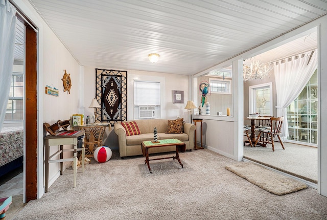 3309 Dumont Lake Dr, Allegan, MI 49010 - carpeted living area featuring a chandelier and baseboards