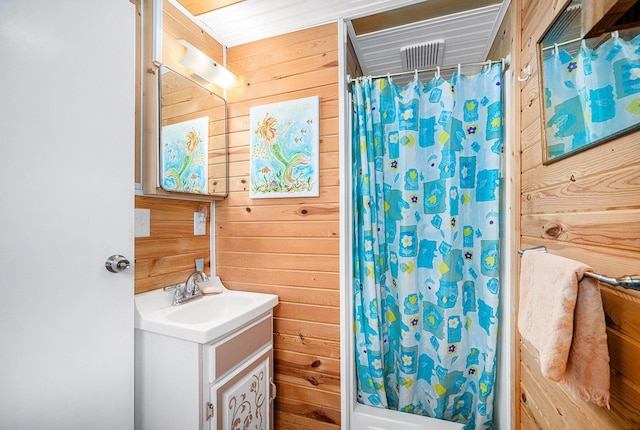 3309 Dumont Lake Dr, Allegan, MI 49010 - bathroom with wooden walls and vanity