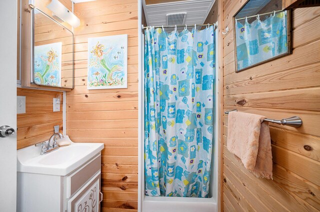 3309 Dumont Lake Dr, Allegan, MI 49010 - full bath with wood walls, a shower with shower curtain, and vanity