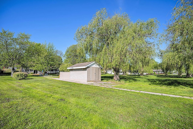 3309 Dumont Lake Dr, Allegan, MI 49010 - view of grassy yard with a shed and an outdoor structure