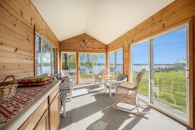 3309 Dumont Lake Dr, Allegan, MI 49010 - sunroom with a water view, wooden walls, lofted ceiling, plenty of natural light, and carpet floors