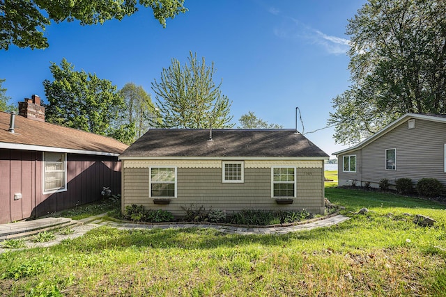 3309 Dumont Lake Dr, Allegan, MI 49010 - rear view of property featuring a yard