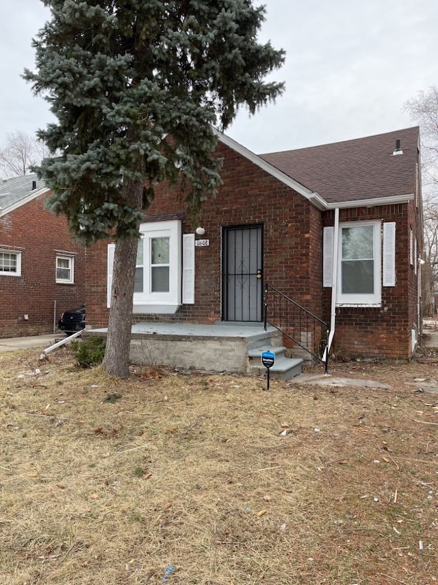11608 Beaconsfield St, Detroit, MI 48224 - bungalow-style home with brick siding and a shingled roof